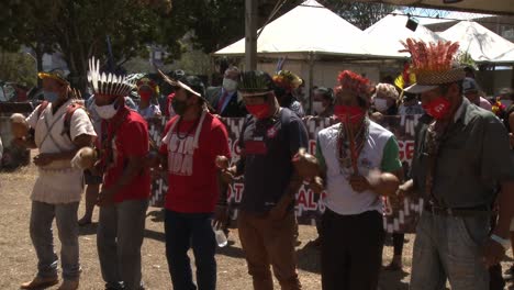 Tribal-members-wear-face-masks-and-traditional-headdresses-at-a-demonstration-for-preservation-of-the-Amazon-rainforest