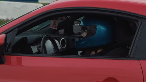 Girl-drifter-wearing-a-helmet-is-waiting-in-the-car-for-race