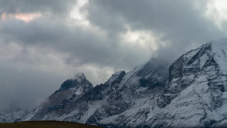 Moody-Clouds-Rolling-Off-Summit-Of-Cuernos-del-Paine-Granite-Peaks-In-Chile