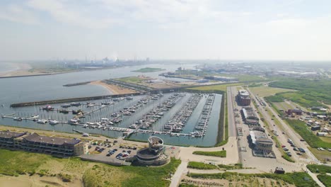 Aerial-view-approaching-boats-in-harbour,-Ijmuiden,-Netherlands