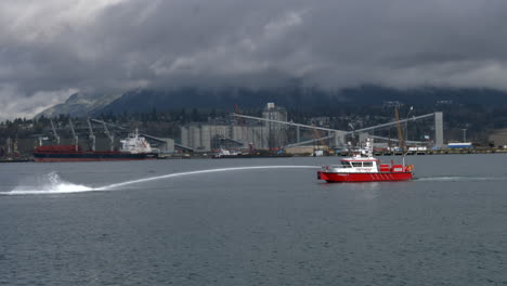 Vancouver-Fireboat-Spraying-Water-At-Burrard-Inlet-At-Daytime-In-Vancouver,-Canada