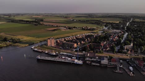 Aerial-View-Of-Shipping-Port-At-Puttershoek-On-Oude-Maas-In-Netherlands