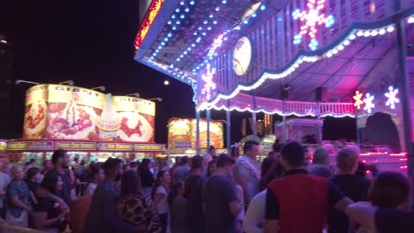 A-crowd-of-people-lined-up-for-a-carnival-ride-at-the-CNE-in-Toronto,-Canada