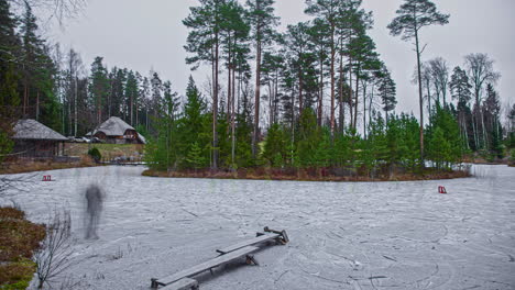 timelapse-of-people-walking-around-over-a-frozen-lake-at-a-wild-park-area