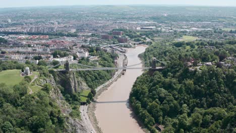 Cinematic-Dolly-forward-pan-down-drone-shot-over-Clifton-Suspension-bridge-Bristol