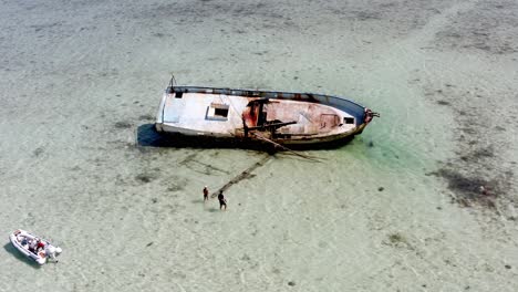 Aerial-View-Of-Abandoned-Shipwreck-In-The-Ocean-Near-The-Bahamas