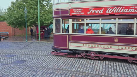 Vintage-electrified-tram-and-female-at-Beamish-open-air-museum