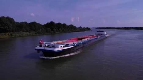 Comienzo-Cargo-Container-Ship-Navigating-Oude-Maas-Through-Puttershoek