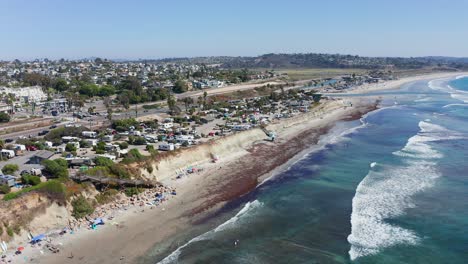 Aerial-shot-over-Cardiff-By-The-Sea-beach-and-city-in-California,-America