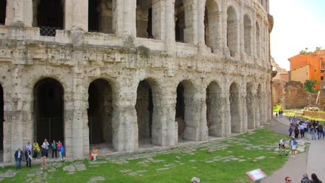 Tourists-At-Theatre-of-Marcellus,-Ancient-Open-air-Theatre-In-Rome,-Italy