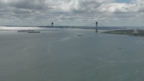 An-aerial-view-of-Gravesend-Bay-in-Brooklyn,-NY-on-a-beautiful-day-with-blue-skies-and-clouds