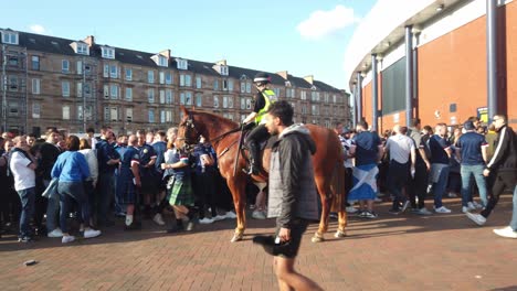 A-female-mounted-police-officer-watching-football-fans