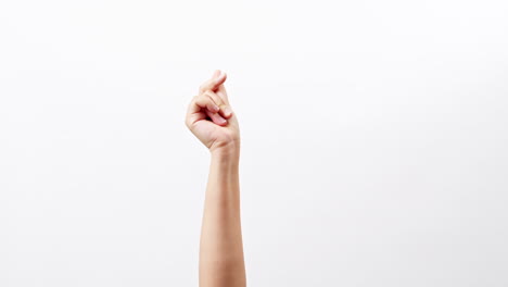 Close-up-of-Woman's-hand-snapping-her-finger-doing-the-hand-gesture-isolated-on-a-white-studio-background-with-copy-space-for-place-a-text,-message-for-advertisement-and-promote-brand-and-product