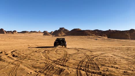 Off-road-vehicle-Exploring-Al-Ula-Desert-Valley,-Saudi-Arabia