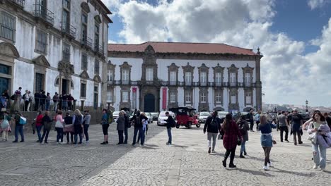 Crowd-of-people,-tourists-visiting-Porto-Cathedral,-Portugal