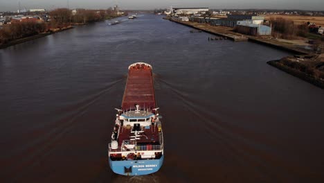Aerial-Drone-View-Of-Wilson-Mersey-Navigating-River-Noord-On-Clear-Sunny-Day