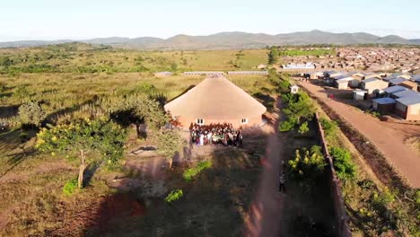 Group-of-Black-Skin-Tone-Refugees-Holding-Brazil-Flag-in-Dzaleka-Camp