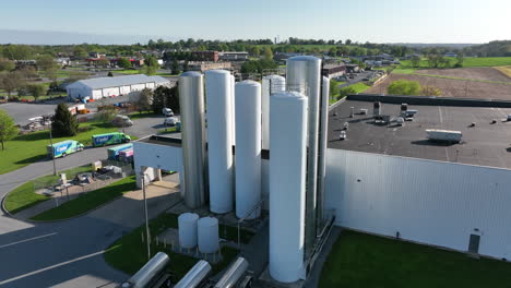 Factory-with-holding-tank-silo-at-commercial-building-location