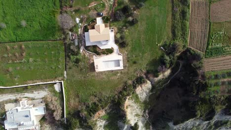 Dramatic-very-hig-aerial-view-flight-slowly-circle-360-drone-footage-of-a-luxury-villa-at-paradise-wild-nature-Beach-Marathias-Malibu-Corfu-Greece
