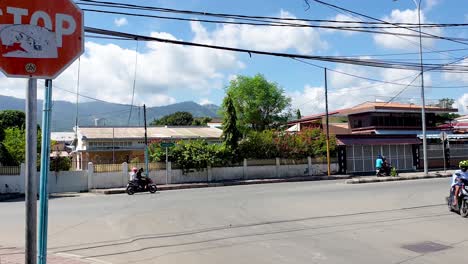 A-daily-sight-of-traffic-in-the-capital-Dili,-Timor-Leste,-cars,-motorbikes,-scooters-and-a-yellow-taxi-in-the-Southeast-Asian-city