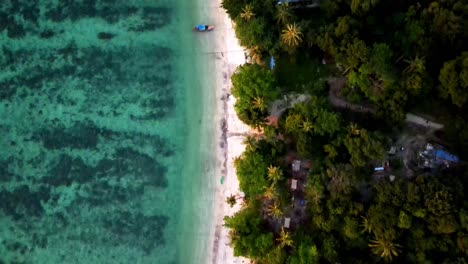 Aerial-Birds-Eye-Flying-Over-Sunset-Beach-Sandwiched-Between-Turquoise-Waters-And-Tropical-Rainforest