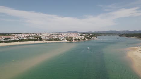 Aerial-view-of-scenic-Mira-river-Estuary-on-Southwest-National-Park,-Vila-Nova-de-Milfontes,-Portugal