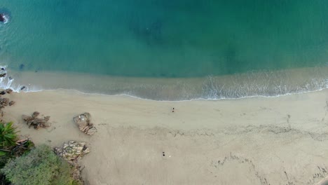 Top-View-Of-People-Walking-On-Sandy-Shore-Of-Yelapa-Beach-In-Jalisco,-Mexico