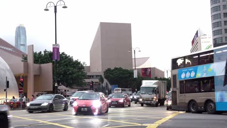 A-stationary-footage-of-a-heavy-traffic-in-a-road-junction-in-Tsim-Sha-Tsui,-Hong-Kong