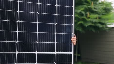 Bringing-solar-panel-across-the-backyard,-commercial-ad-background-with-copy-space