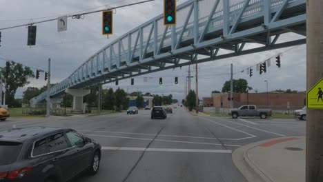 Truck-POV:-Driving-underneath-a-bridge-in-Indiana,-USA