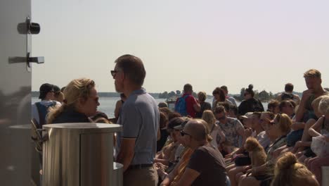 Tourists-and-local-people-crowd-onto-ferry-boat-to-enjoy-day-on-water