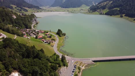 Aerial-of-lake-Silhlsee-in-Switzerland-revealing-mountains-and-village