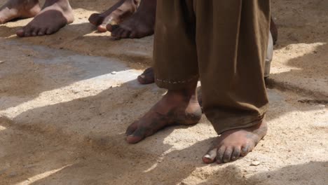 Close-Up-View-Of-Dirty-Bare-Feet-Of-Local-In-balochistan-standing