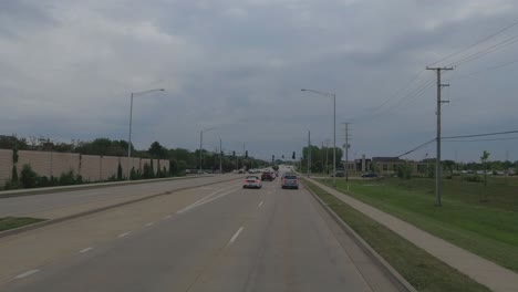 Traveling-in-the-Chicago-Illinois-area,-suburbs,-streets,-and-highways-in-POV-mode-us-30-near-Frankfort-Illinois-at-stop-light