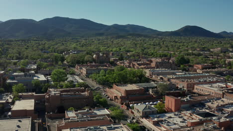 Aerial-moving-away-from-downtown-Santa-Fe-New-Mexico-skyline