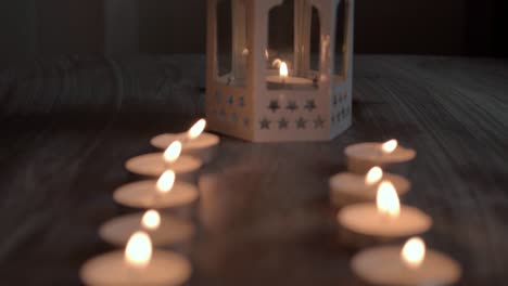 Row-of-candles-with-candle-lantern