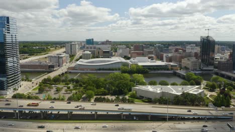 Downtown-Aerial-view-of-Varnum-Building-in-Grand-Rapids,-Michigan-with-Highway-131-in-the-foreground