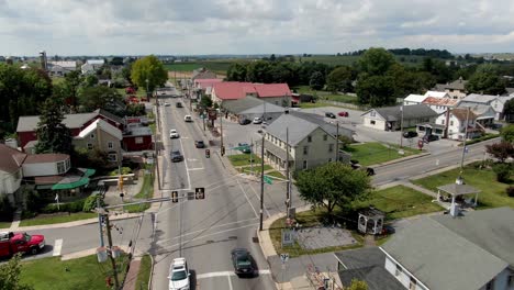 Slow-aerial-panning-shot-featuring-small-businesses-and-rural-countryside-in-Lancaster-County-PA-Amish-tourist-country