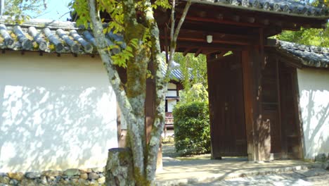 Traditional-wooden-gate-entrance-in-Kyoto,-Japan-soft-lighting-slow-motion-4K