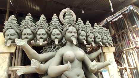 Slow-camera-movement-around-unfinished-clay-idol-of-Indian-Goddess-Kali