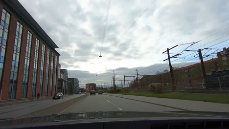 POV-Driving-view-car-through-cloudy-weather-in-central-area-in-Copenhagen,-Denmark