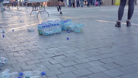 Plastic-water-bottles-that-was-prepared-for-marathon-runners-to-drink-laying-on-the-ground,-plastic-waste-concept
