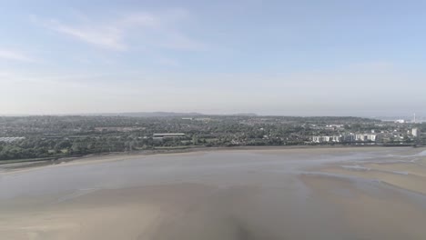 Landmark-Silver-Jubilee-bridge-skyline-panning-across-river-Mersey-Runcorn-Widnes-aerial-view-skyline