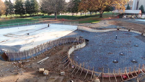 AERIAL-PAN-LEFT-Scaffolding-Of-Public-Swimming-Pool-Under-Construction