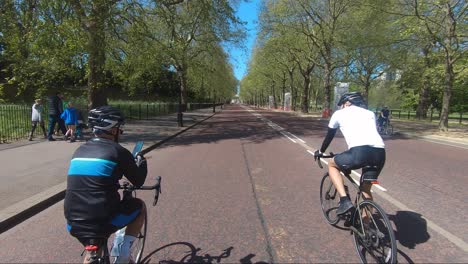 Male-Cyclist-Taking-Photo-Whilst-Riding-Down-Constitution-Hill-During-Coronavirus-Lockdown-In-London