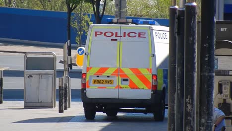 Covid-corona-virus-police-patrol-enforcement-restriction-in-empty-lock-down-deserted-town-UK