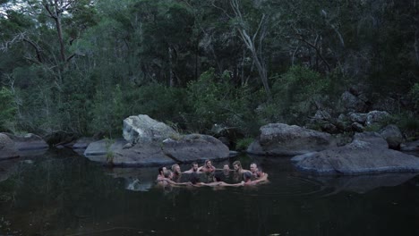 Diverse-Men-Huddling-And-Standing-In-A-Circle-On-Water---Mental-Health-And-Well-being-Program---Counseling-And-Conversation-In-Group-Therapy---Queensland,-Australia