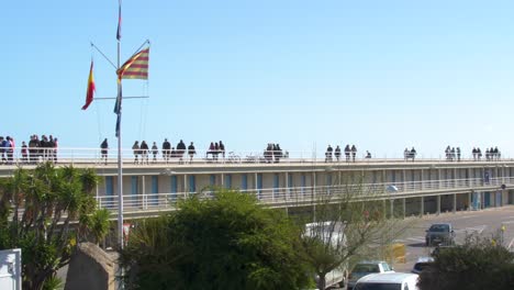 Many-people-walking-on-the-jetty-on-a-sunny-day-because-of-the-covid19-restrictions