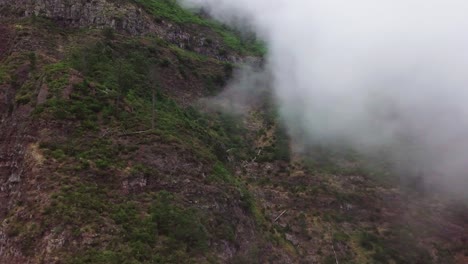 Scenic-Landscape-View-Through-The-Clouds-From-Eira-Do-Serrado-Viewpoint-In-Funchal,-Portugal---high-angle-shot