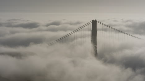 The-supports-of-a-bridge-protruding-from-the-mist